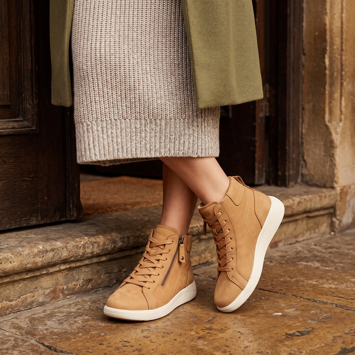 Tan Strive Kensington trainers styled with a jumper dress