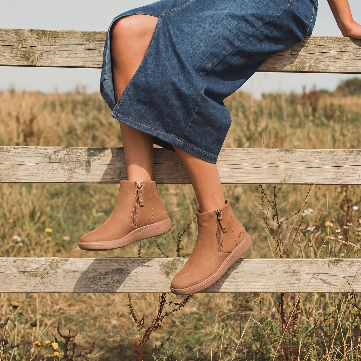 Tan Strive Mayfair ankle boots styled with a denim dress