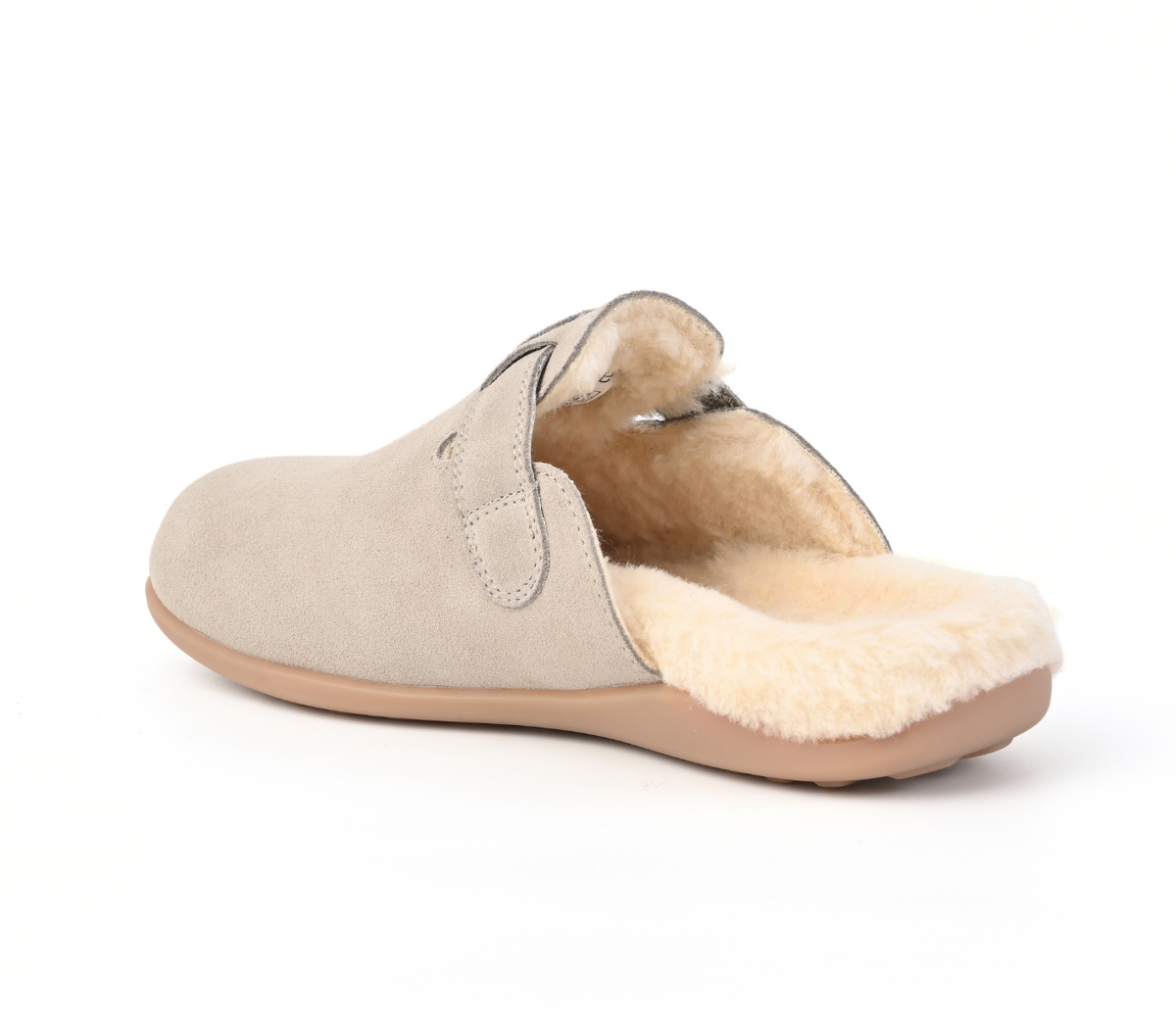 A light beige suede slip-on mule slipper with a plush cream shearling lining, shown from a side-rear angle on a white background. Strive Footwear Oslo II Women’s Grey Slippers
