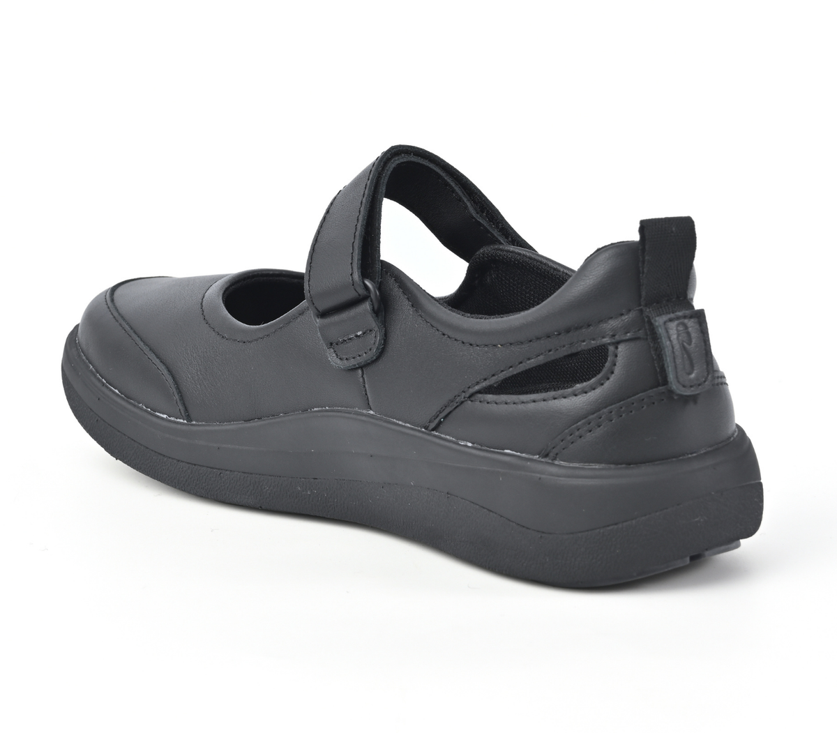 A single black Mary Jane-style slip-on Strive Footwear Skip shoe with a hook-and-loop strap and thick platform sole, shown from a side-rear angle on a white background.