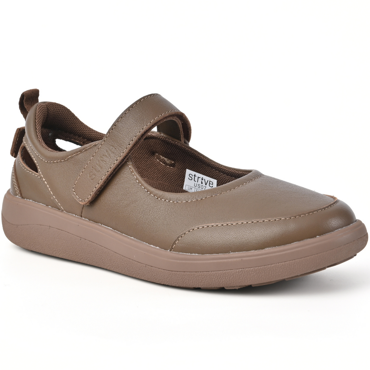 Strive Footwear Skip single brown slip-on shoe with a hook-and-loop strap across the instep, shown from a three-quarters angle on a white background.