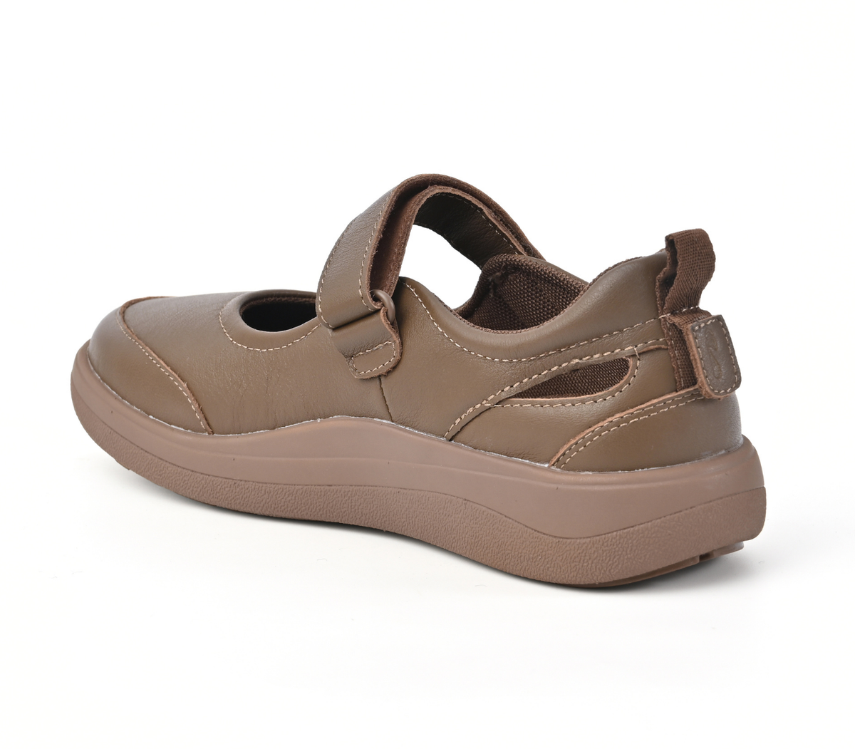 Strive Footwear Skip single brown slip-on shoe with a hook-and-loop strap closure and a thick cushioned sole, shown from a three-quarters angle on a white background.