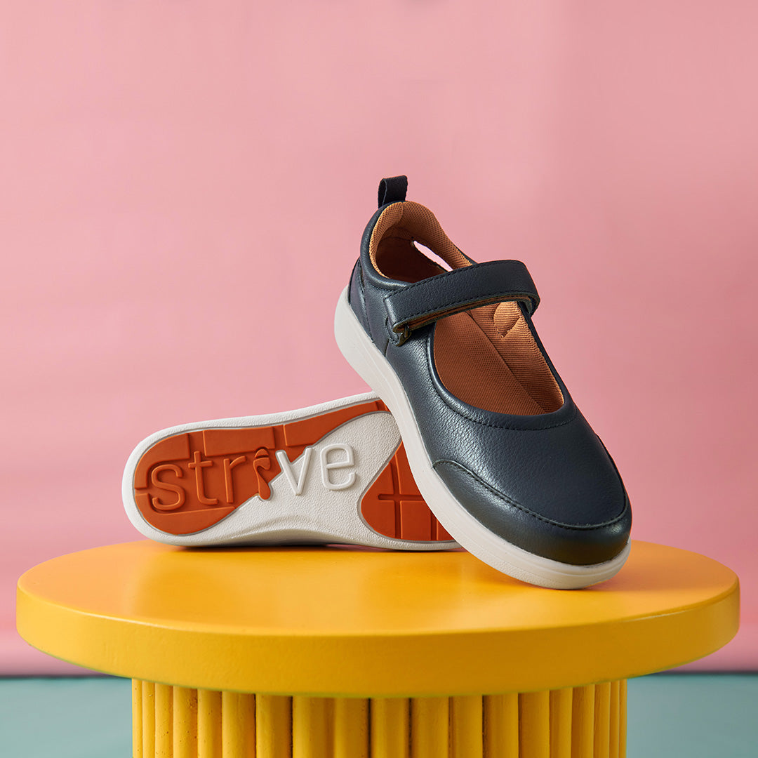 Strive navy leather Mary Jane Skip shoe with adjustable strap, cushioned footbed and white sole