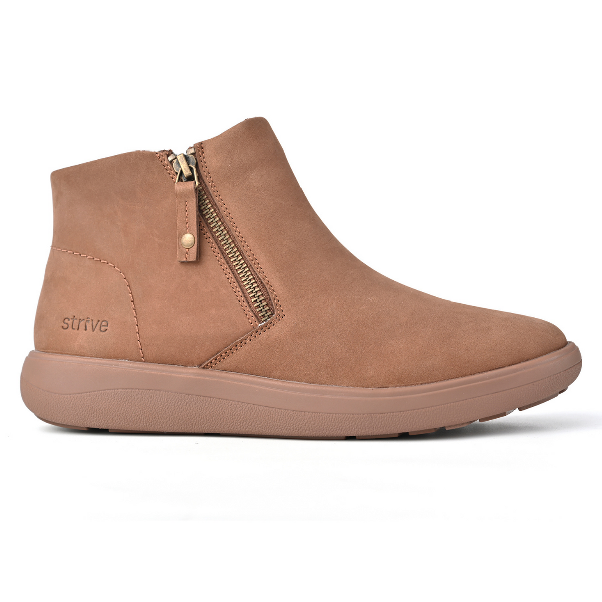 A light brown suede ankle boot with a side zipper, shown in profile against a white background. The brand name 'strive' is subtly embossed on the side. Strive Footwear Women’s Mayfair Brown Boots