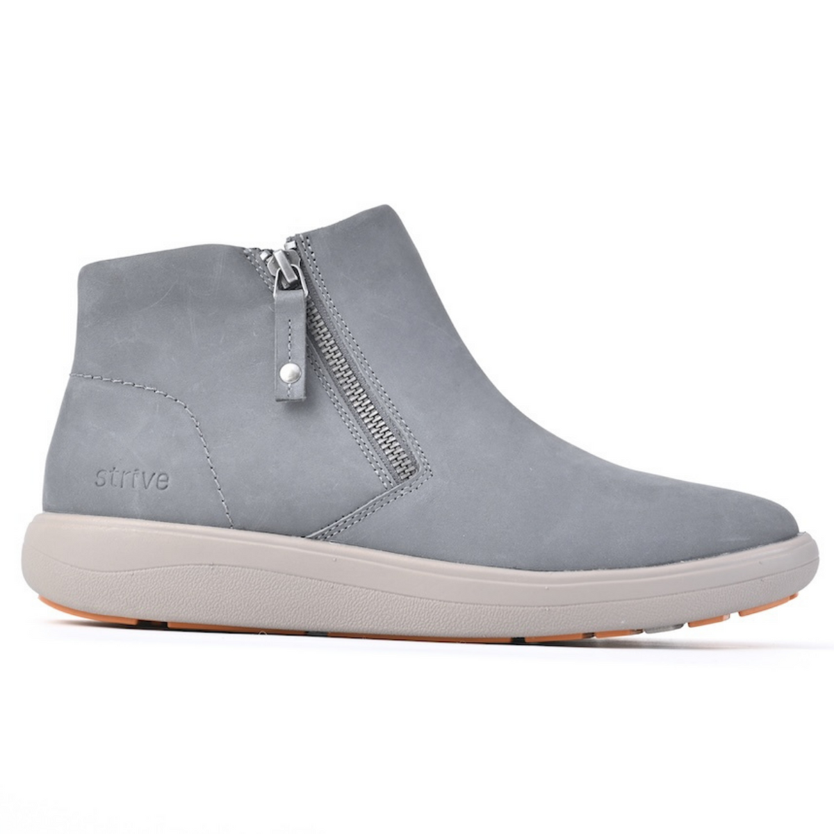 A light grey suede ankle boot with a side zipper, a thick off-white sole, and the 'strive' brand name embossed on the side, shown against a plain white background. Strive Footwear Women’s Mayfair Black Boots