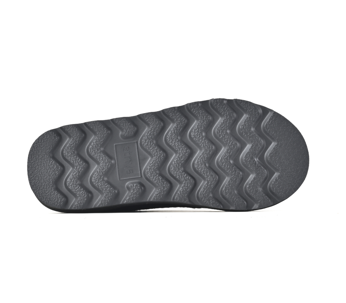 The textured grey rubber outsole of a shoe, showing a wavy tread pattern and a moulded brand label in the centre, isolated on a white background. Strive Footwear Zurich Felt Slippers Black