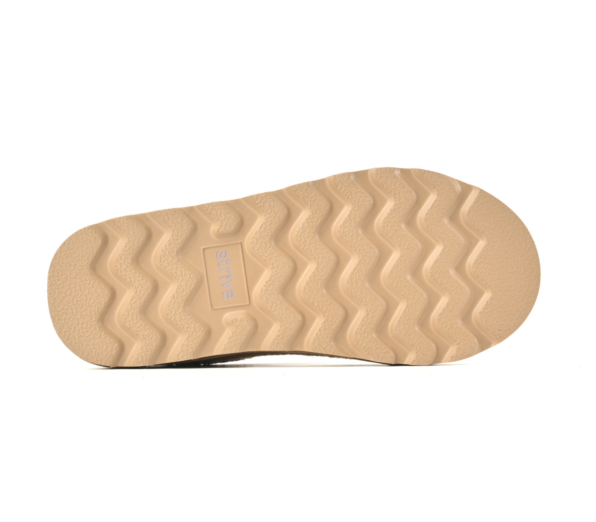 The tan rubber outsole of a shoe, featuring a wavy tread pattern and a small embossed 'STRIVE' logo, shown against a plain white background.