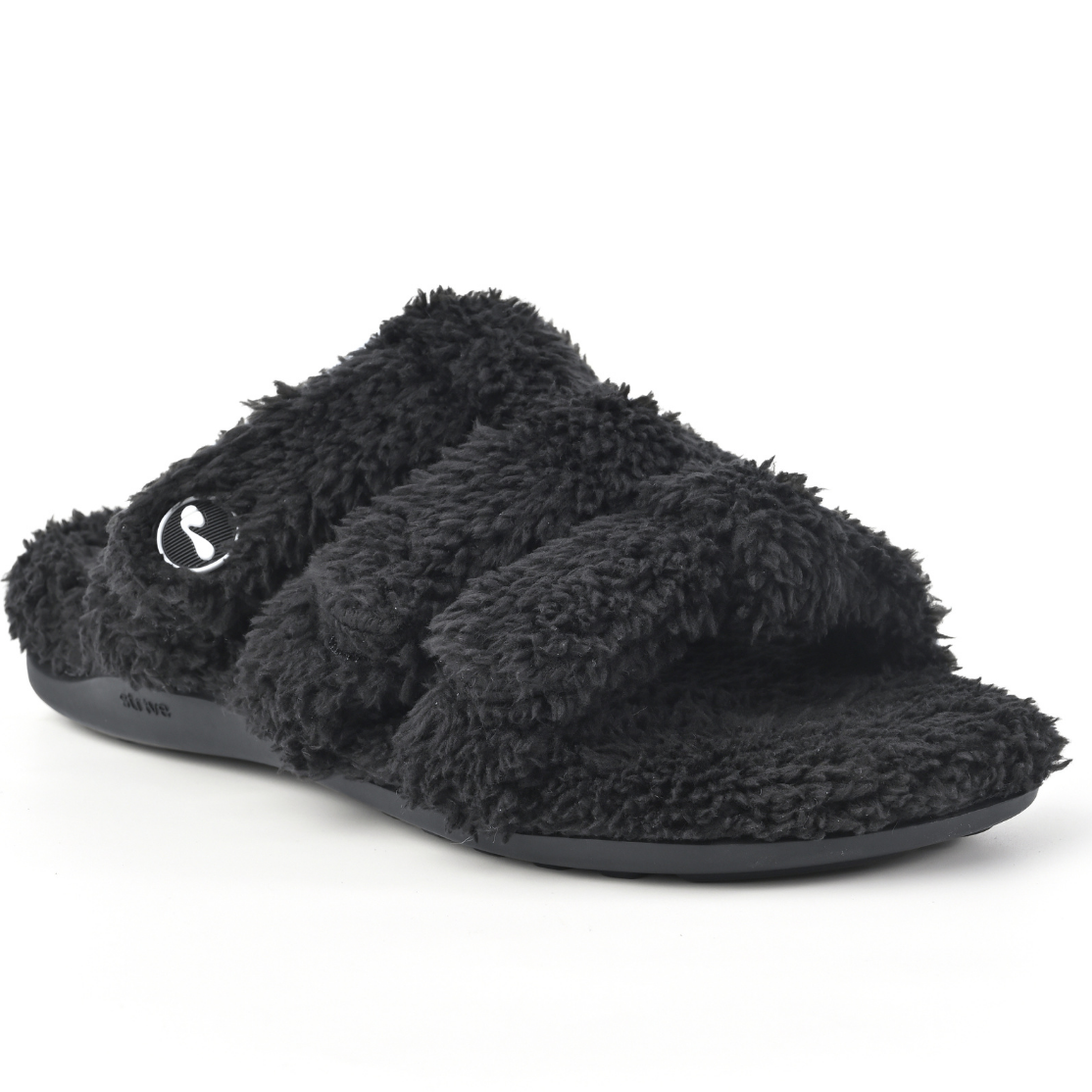 A single black fuzzy slide sandal with wide textured straps and a small circular logo on the side, shown on a plain white background.